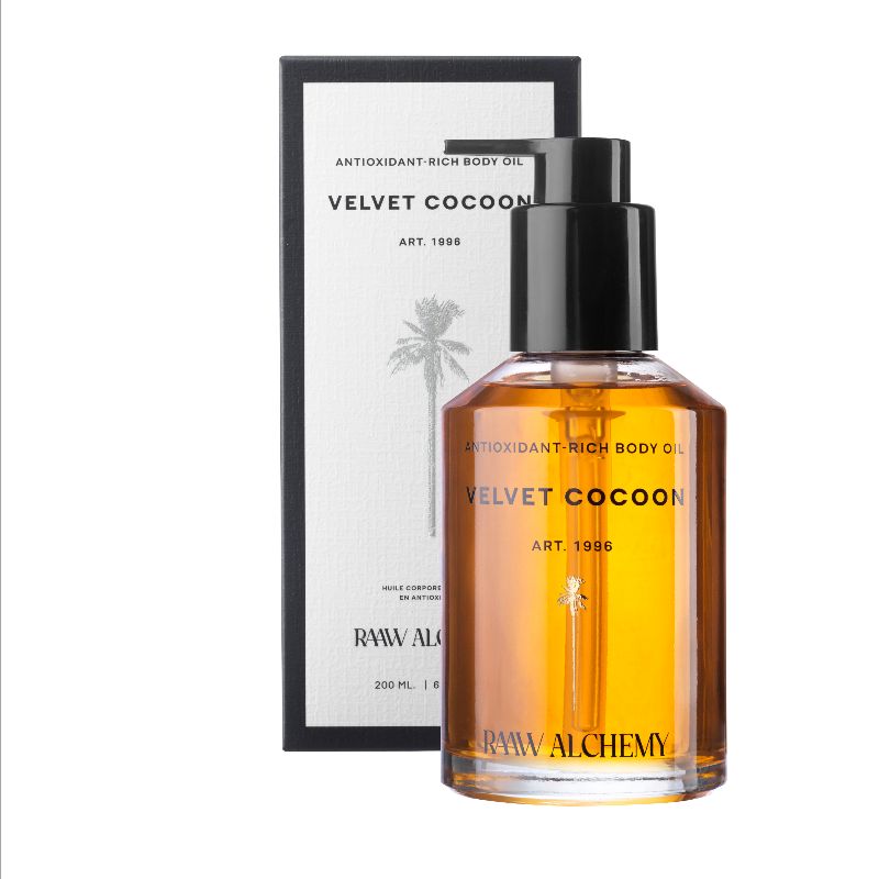 591858DF-4C48-4F7E-9657-585B21DED331 Flasche und Verpackung von Raaw Alchemy Velvet Cocoon Körperöl, reich an Antioxidantien, 200 ml.