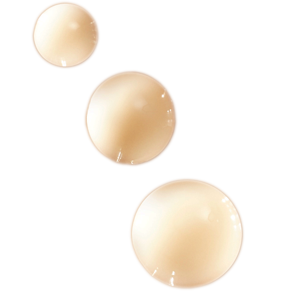 Drei Tropfen des Night Star Serums auf weißem Hintergrund.