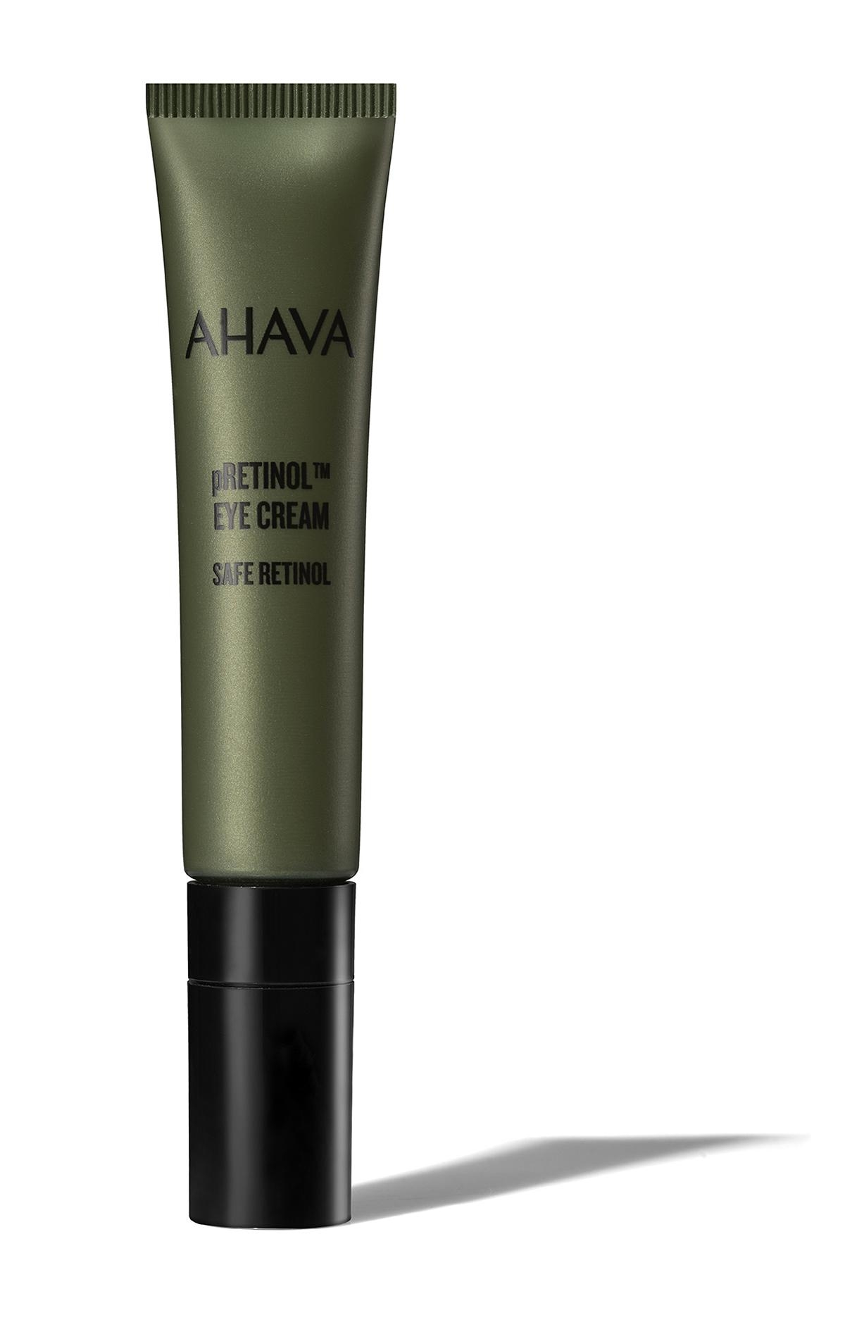 Grüne Tube AHAVA Retinol Augencreme mit schwarzem Deckel auf weißem Hintergrund.