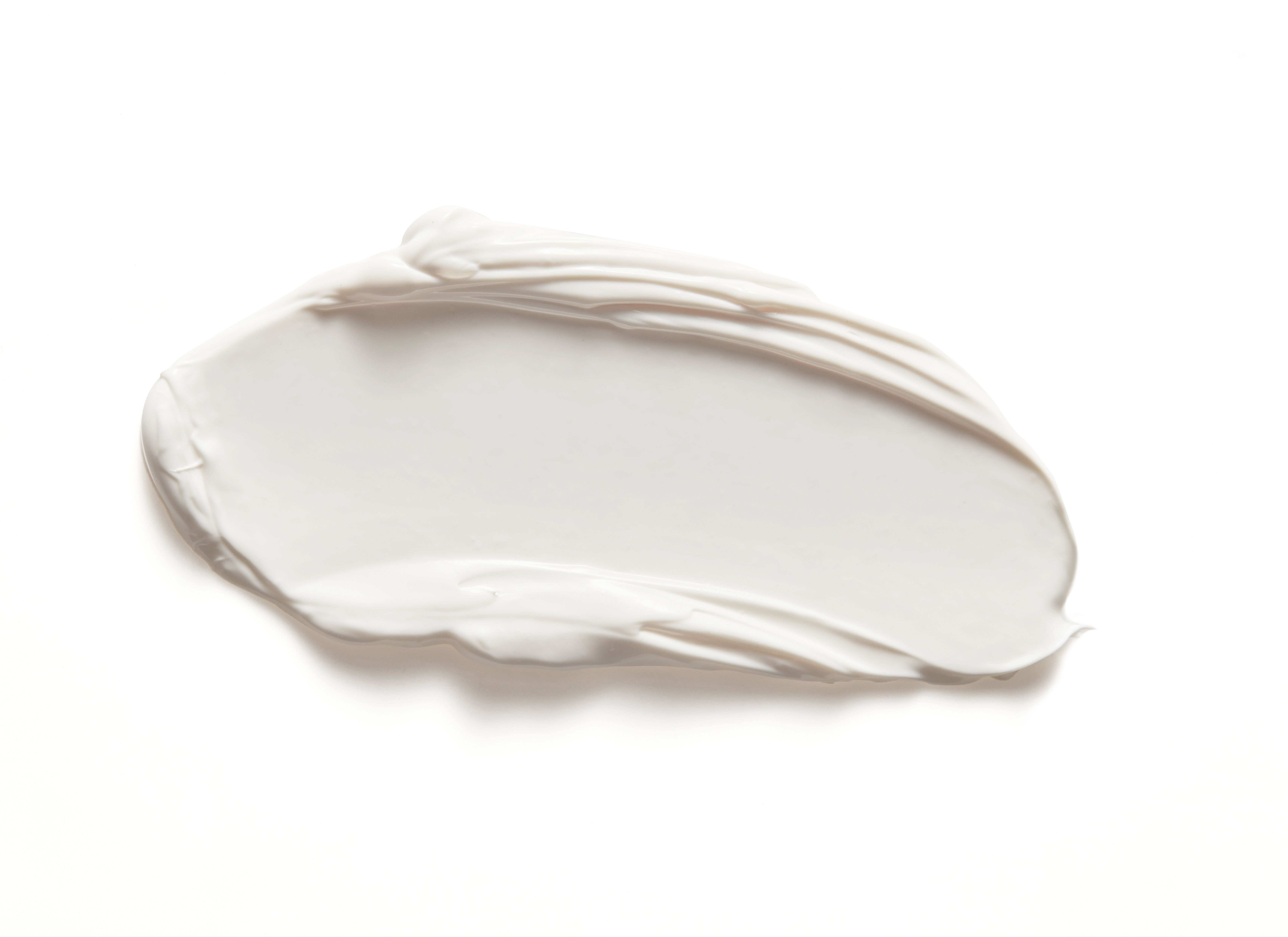 Extreme-Screen-Swatch Nahaufnahme einer weißen Creme auf weißem Hintergrund.