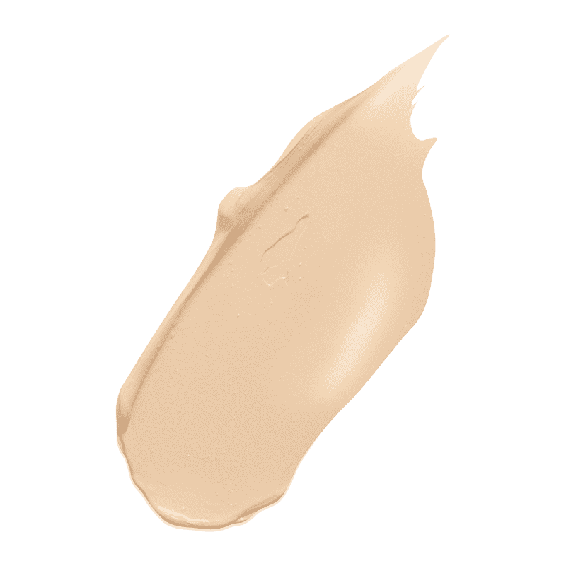 Beige Concealer-Swatch auf grünem Hintergrund.